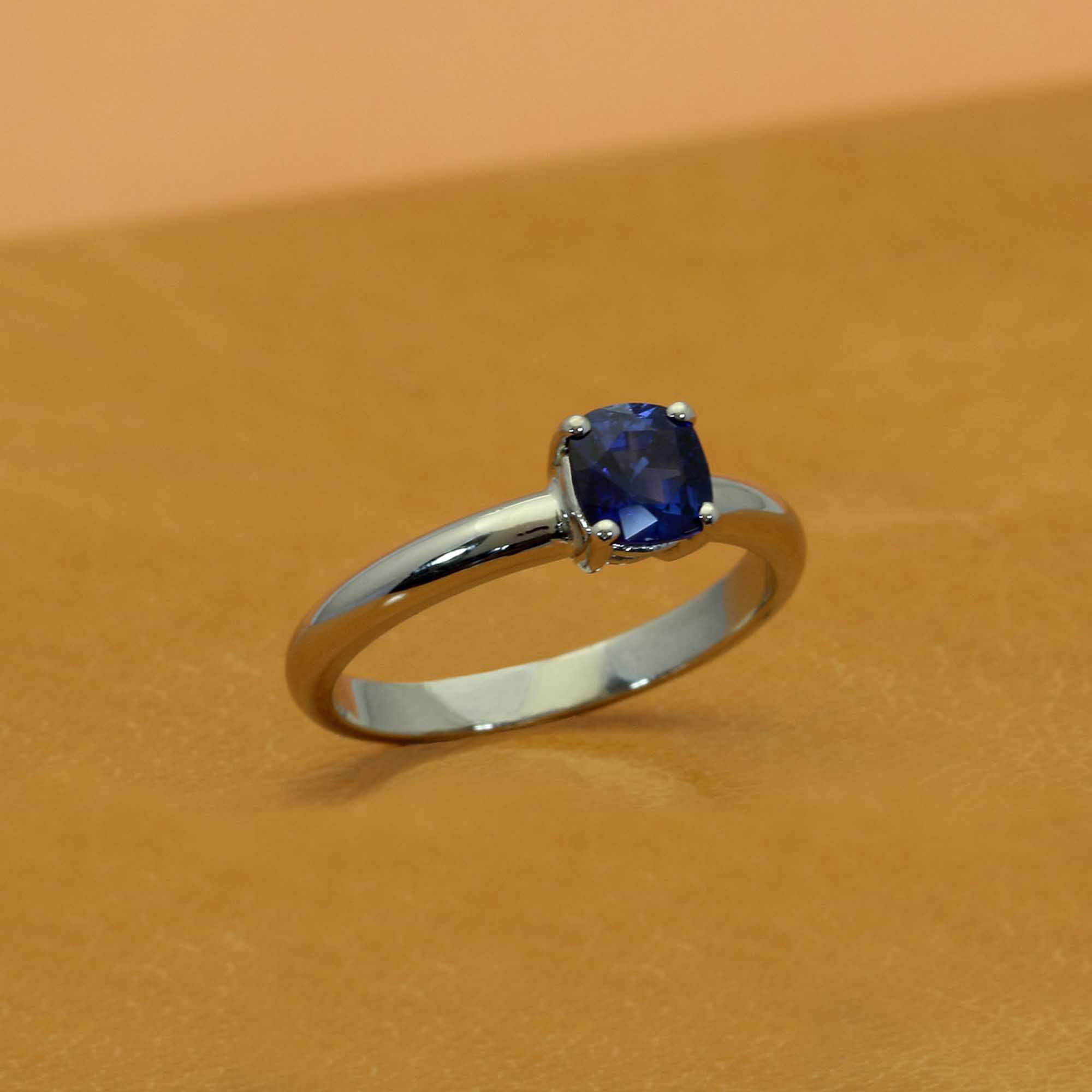 Alternative engagement ring in palladium with blue sapphire