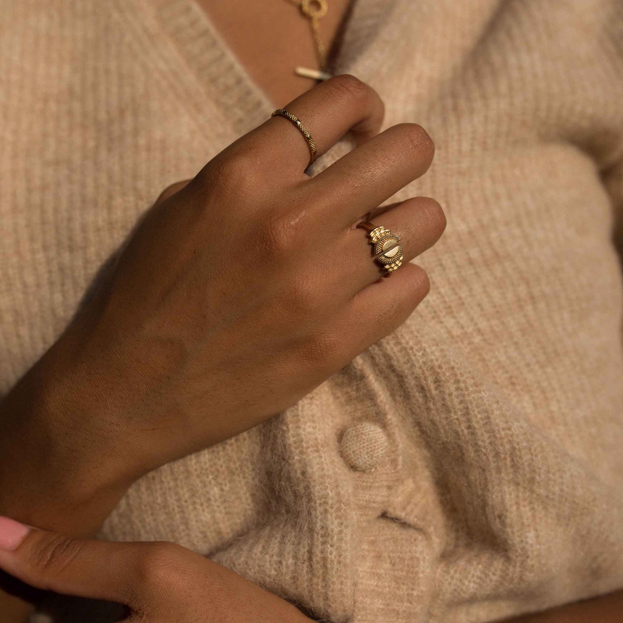 Model wearing yellow gold open statement ring