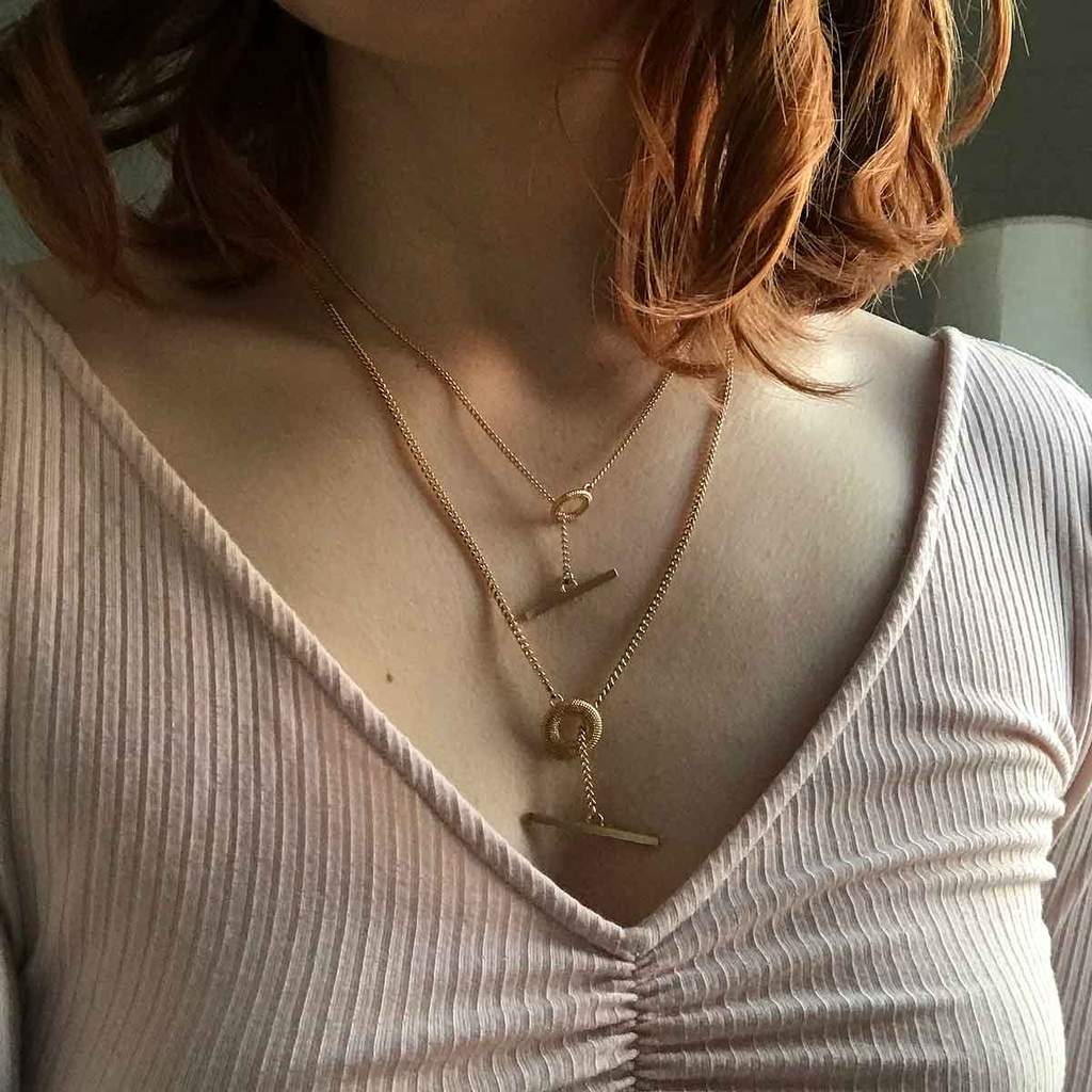 2 t bar necklaces worn by model