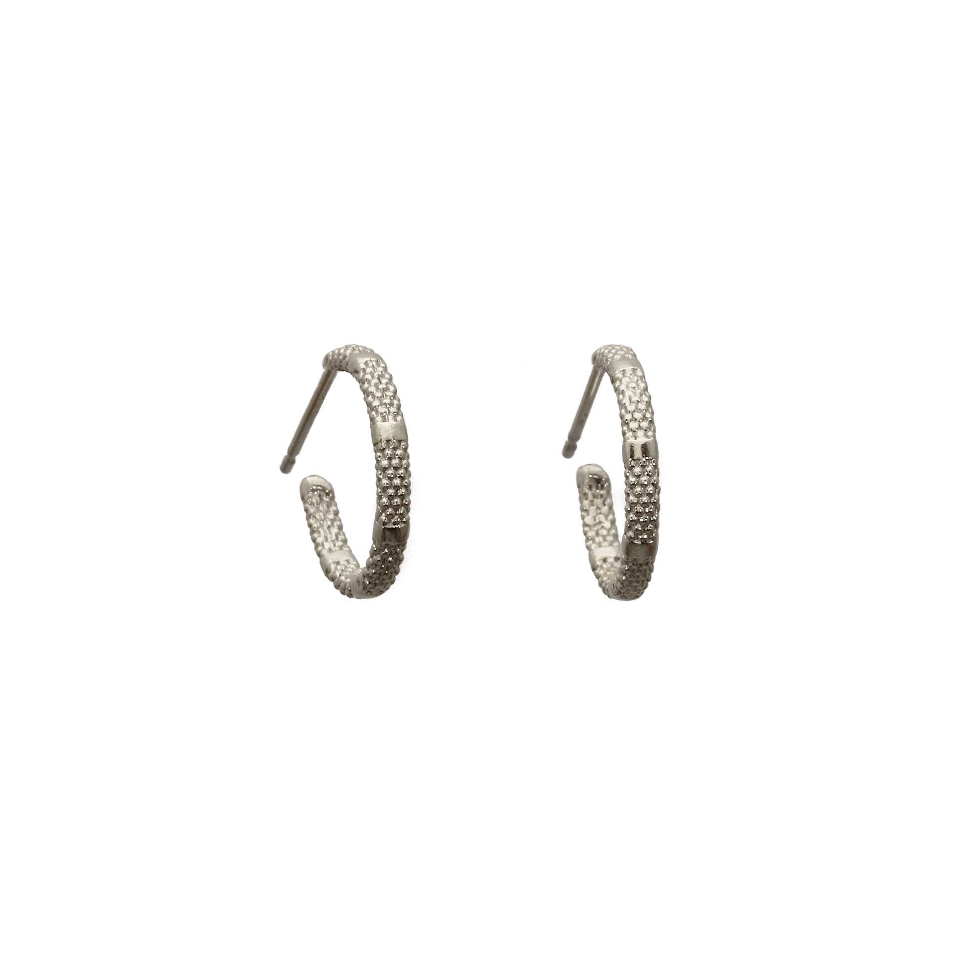 Sterling silver hoop earrings with alternating rough and smooth texture