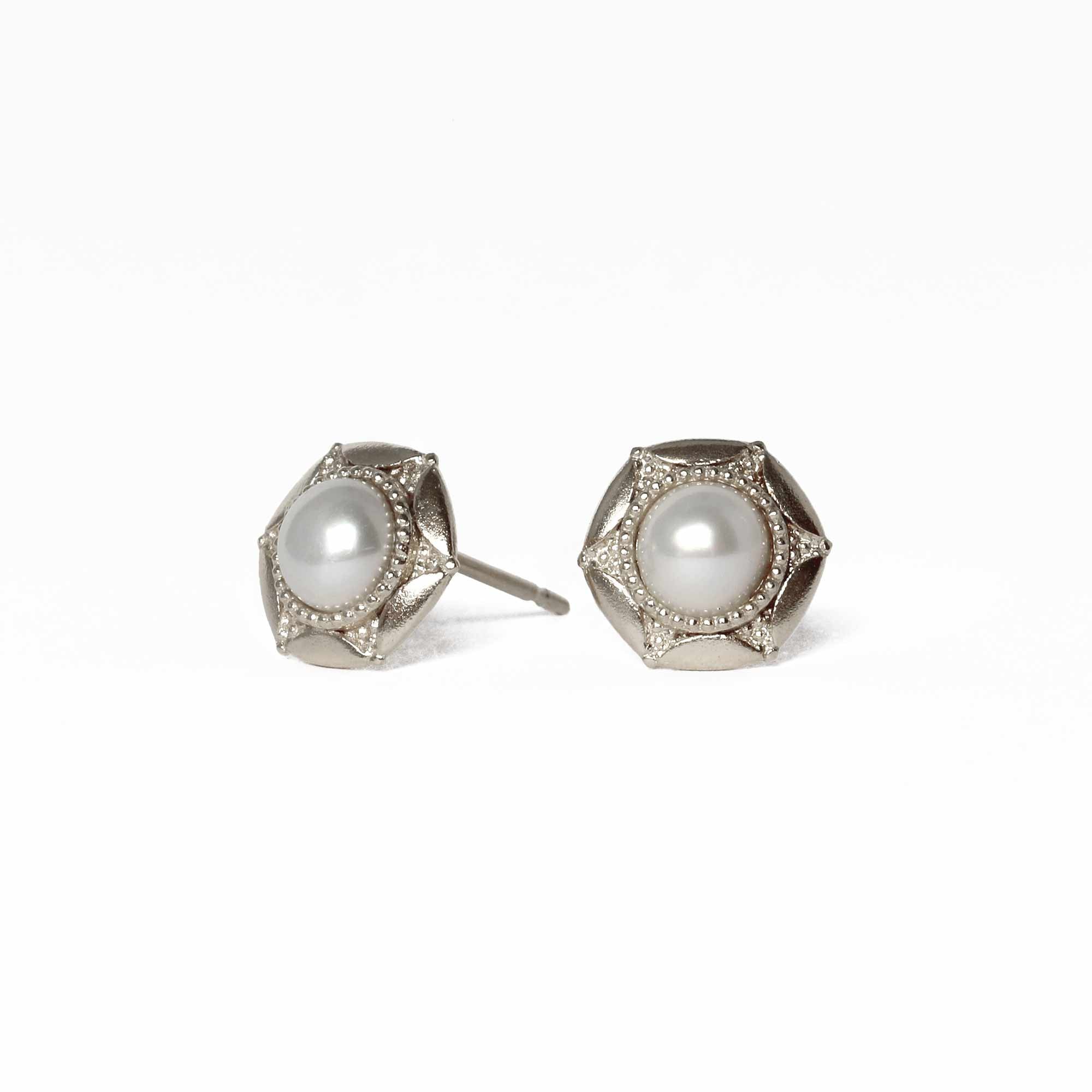 Statement textured silver pearl earrings, inspired by the moon. product shot on white background