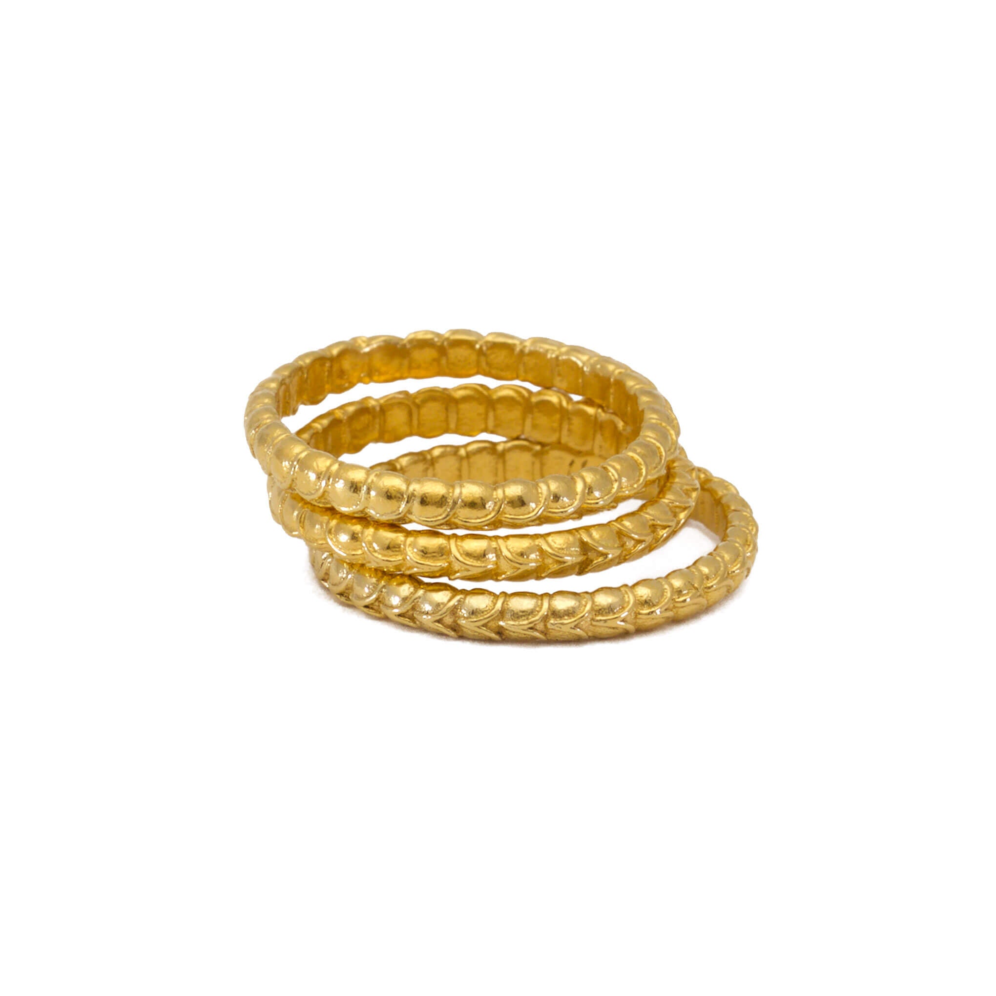 A stack of gold alternative rings