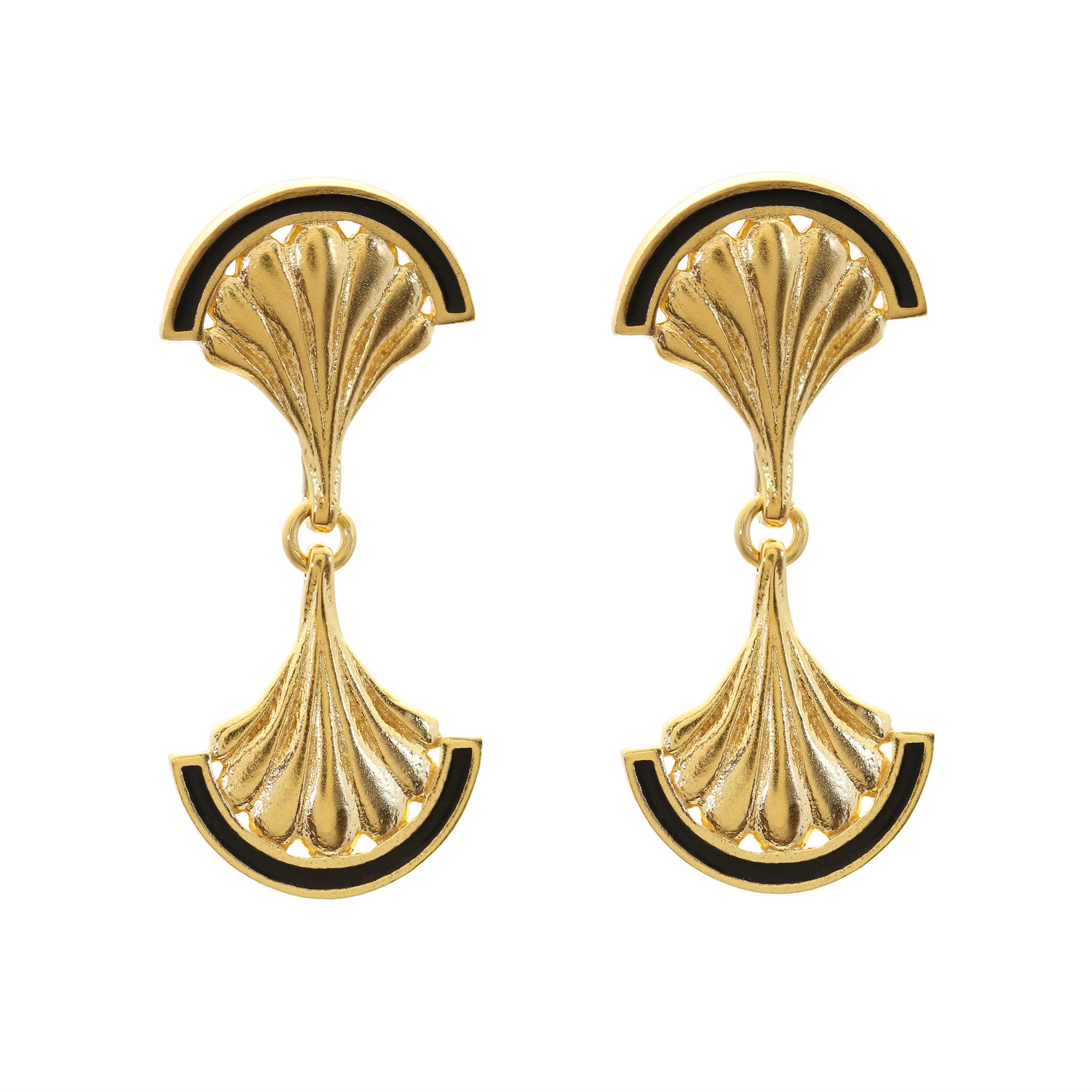 A pair of gold shell drop earrings with black enamel detail