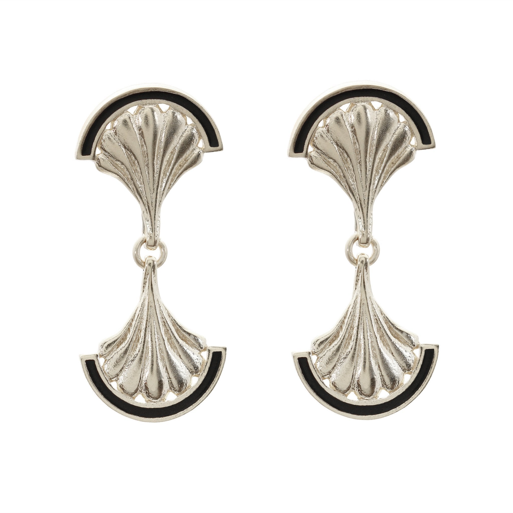 A pair of silver shell drop earrings with black enamel detail
