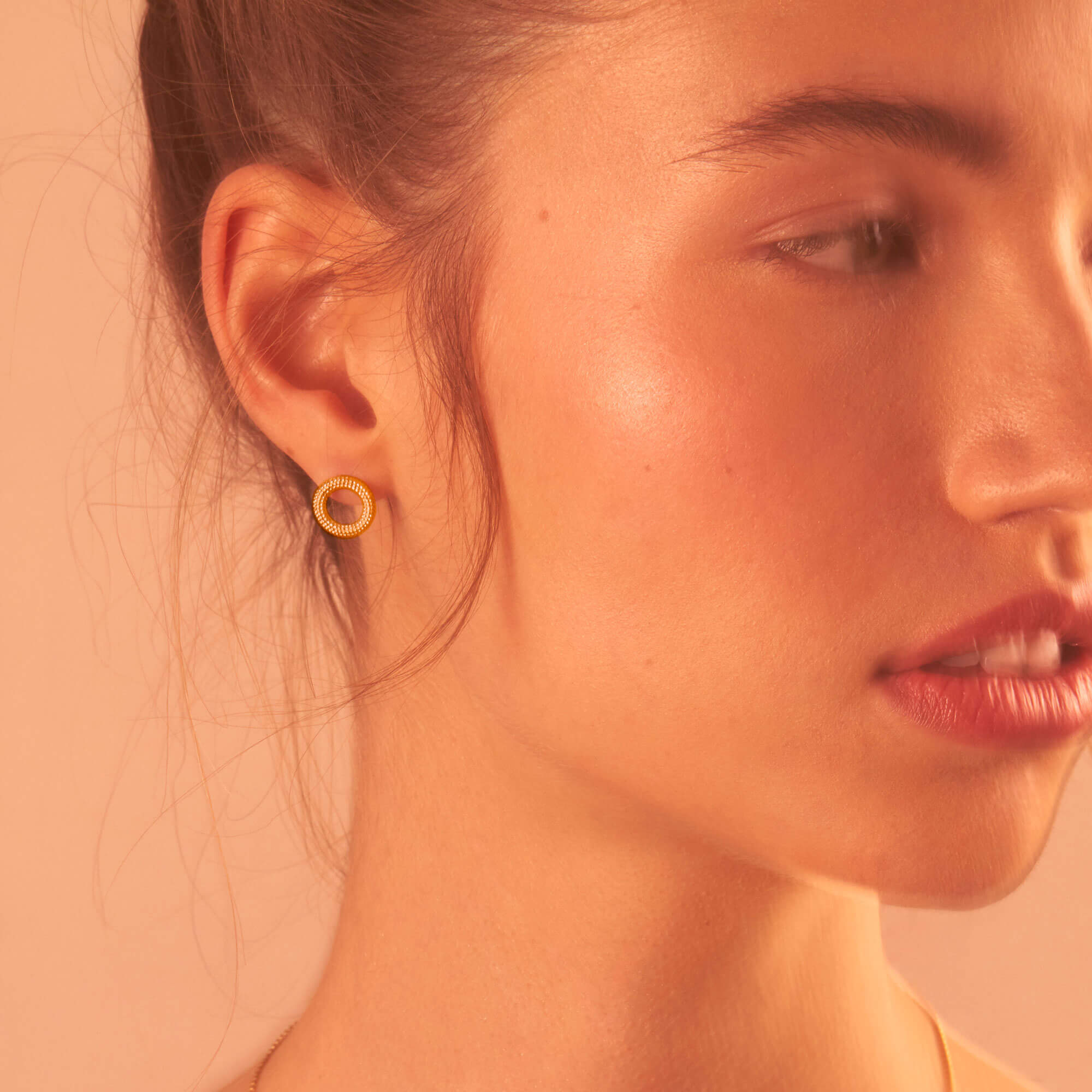 Model wearing Tyro Yellow Gold Stud Earrings