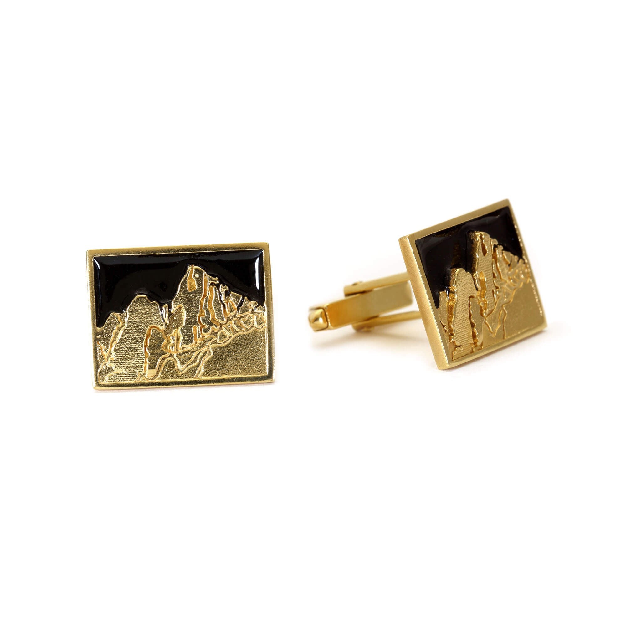 A pair of Cuillin Ridge mountain cufflinks in gold and black enamel