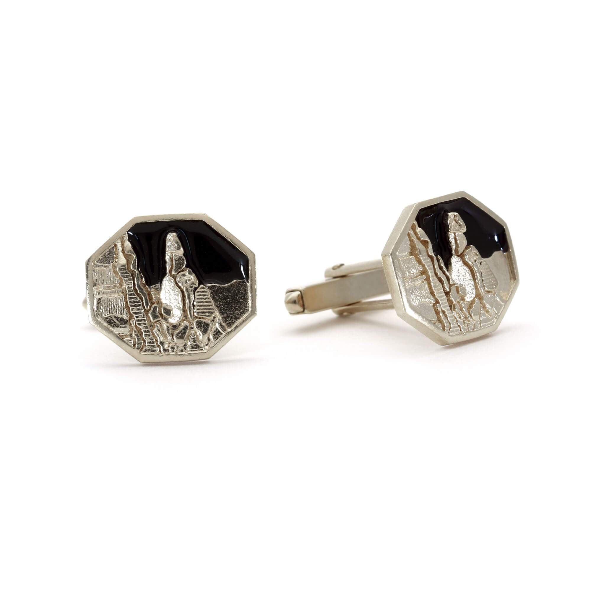 A pair of sterling silver and enamel cufflinks picturing Napes Needle