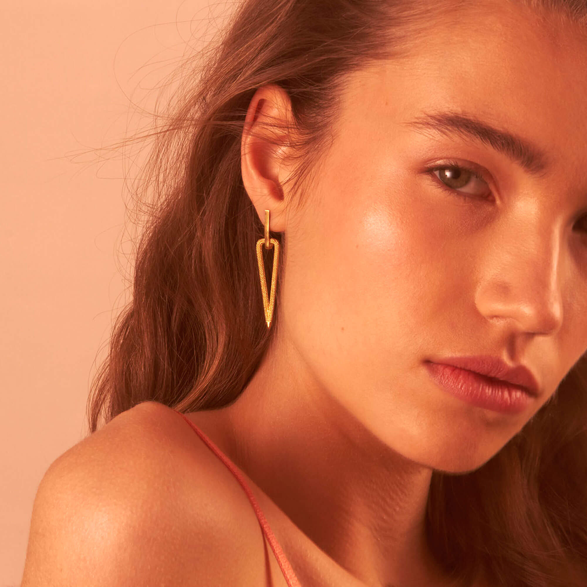 A model wearing Zinnia Yellow Gold Drop Drop Earrings